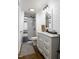 Modern bathroom features a shower, white-painted brick and black finishes at 3906 Union Ridge Rd, Burlington, NC 27217