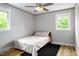 Cozy bedroom featuring two windows with lots of natural light and wood-look flooring at 3906 Union Ridge Rd, Burlington, NC 27217
