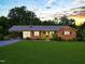 Charming brick home with a well-manicured lawn and covered carport perfect for enjoying the outdoors at 3906 Union Ridge Rd, Burlington, NC 27217