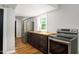 A clean kitchen with stainless steel appliances, light gray walls, wood floors and butcher block countertops at 3906 Union Ridge Rd, Burlington, NC 27217