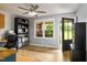 Bright office space with wood floors, natural light, and a ceiling fan at 3906 Union Ridge Rd, Burlington, NC 27217