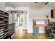 Inviting home office with barn doors offers a quiet and stylish workspace, adjacent to kitchen and living area at 3906 Union Ridge Rd, Burlington, NC 27217