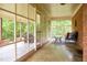 Bright and airy screen porch with views of the surrounding trees at 3906 Union Ridge Rd, Burlington, NC 27217