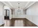 Formal dining room featuring decorative ceiling, hardwood floors, and large windows at 3908 Chaumont Dr, Apex, NC 27539