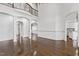 Open-concept living room with hardwood floors and plenty of natural light at 3908 Chaumont Dr, Apex, NC 27539