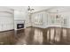 Spacious living room with a fireplace, built-in shelves, and large windows at 3908 Chaumont Dr, Apex, NC 27539