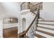 Elegant staircase with iron railings leading to the second floor at 3908 Chaumont Dr, Apex, NC 27539