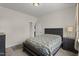 Bedroom featuring a dark wood bed frame with a patterned comforter and matching bedside tables at 4612 Hanging Fern Ln, Raleigh, NC 27604