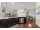Kitchen and dining area with stainless steel appliances, granite countertops, and an open floor plan at 4612 Hanging Fern Ln, Raleigh, NC 27604