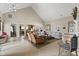 Spacious living room with vaulted ceilings, tile floors, and comfortable seating area at 4612 Hanging Fern Ln, Raleigh, NC 27604