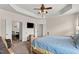 Spacious main bedroom featuring a ceiling fan, with an entryway view to the dining area at 4612 Hanging Fern Ln, Raleigh, NC 27604