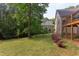 Spacious backyard with well-maintained lawn, garden, and mature trees, offering a private outdoor space at 504 Belmont Cir, Wake Forest, NC 27587