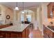 An elegant dining room is attached to the kitchen and features an arched doorway at 504 Belmont Cir, Wake Forest, NC 27587