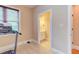 Bright exercise room leading to bathroom, well-lit by natural light at 504 Belmont Cir, Wake Forest, NC 27587