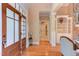 Inviting foyer featuring hardwood floors, natural light, and elegant trim work, leading to living areas at 504 Belmont Cir, Wake Forest, NC 27587