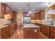 Spacious kitchen features wood cabinets, a large island, and stainless steel appliances at 504 Belmont Cir, Wake Forest, NC 27587