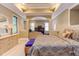 Spacious main bedroom with tray ceiling and sitting area, offers a relaxing retreat at 504 Belmont Cir, Wake Forest, NC 27587