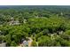 Overhead view of a wooded neighborhood with winding roads and houses at 504 S Dixon Ave, Cary, NC 27511