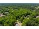 Aerial view of a home in a neighborhood with mature trees and lush landscaping at 504 S Dixon Ave, Cary, NC 27511
