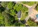 An aerial view of a home showing mature trees and landscaping at 504 S Dixon Ave, Cary, NC 27511