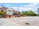 The Cary Arts Center presents a classic facade, red brick exterior, prominent columns, and a welcoming entrance on a tree-lined street at 504 S Dixon Ave, Cary, NC 27511