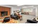 Spacious basement boasts a brick fireplace, white cabinets, and large windows at 504 S Dixon Ave, Cary, NC 27511