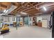 Unfinished basement with exposed ductwork, an outside door, and ample storage at 504 S Dixon Ave, Cary, NC 27511