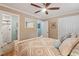 Comfortable bedroom with neutral walls, plush bedding, and a glimpse of an en-suite bathroom at 504 S Dixon Ave, Cary, NC 27511
