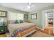 Bedroom with natural light, ceiling fan, and soft carpet at 504 S Dixon Ave, Cary, NC 27511