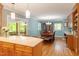 Open dining area with hardwood floors, a wooden table, and a view of the backyard at 504 S Dixon Ave, Cary, NC 27511