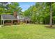 Beautifully maintained home with lush green lawn, mature trees, and a charming covered porch at 504 S Dixon Ave, Cary, NC 27511