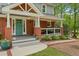 Close-up view of the entry of the home featuring the covered porch with chairs at 504 S Dixon Ave, Cary, NC 27511