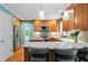 Well-appointed kitchen featuring stainless steel appliances, granite countertops, and custom cabinetry at 504 S Dixon Ave, Cary, NC 27511
