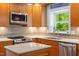 Modern kitchen with stainless steel appliances, granite countertops, and stylish cabinetry at 504 S Dixon Ave, Cary, NC 27511
