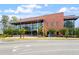 The Cary Regional Library, with its brick facade, features large windows and clear signage for accessible community resources and services at 504 S Dixon Ave, Cary, NC 27511