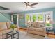 Open living room with hardwood floors and lots of natural light showing the entry and front yard at 504 S Dixon Ave, Cary, NC 27511