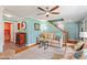 Comfortable living room featuring hardwood floors, ceiling fan, and staircase to the second floor at 504 S Dixon Ave, Cary, NC 27511