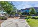 Outdoor seating area with tables and canopies in a park-like setting at 504 S Dixon Ave, Cary, NC 27511
