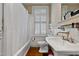 Classic bathroom with a clawfoot tub, white subway tile, and a vintage-style sink, exuding timeless elegance at 517 N East St, Raleigh, NC 27604