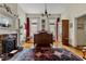 Bedroom with fireplace, wood floors, and large windows offering natural light at 517 N East St, Raleigh, NC 27604