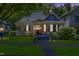 Charming historic home with a classic wraparound porch and lush green lawn at 517 N East St, Raleigh, NC 27604
