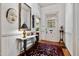 Elegant foyer featuring hardwood floors, rug, and beautiful decor at 517 N East St, Raleigh, NC 27604