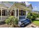 Inviting front porch with charming architectural details and blue painted steps at 517 N East St, Raleigh, NC 27604