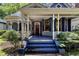 Lovely porch view with seating area and original architectural detailing at 517 N East St, Raleigh, NC 27604