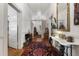 Long hallway showcases the home's original wood floors, and vintage decor at 517 N East St, Raleigh, NC 27604