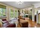 Relaxing living room showcasing hardwood floors, open layout, and French doors at 517 N East St, Raleigh, NC 27604