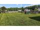 Spacious backyard featuring a playground and lush green grass, perfect for outdoor activities at 5321 Longspur Dr, Snow Camp, NC 27349