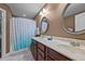 Bathroom with double sink vanity, tile flooring, and a shower-tub combination at 5321 Longspur Dr, Snow Camp, NC 27349