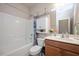 This full bathroom includes a shower-tub, a vanity with a sink, and a toilet at 6512 Blalock Forest Dr, Willow Springs, NC 27592
