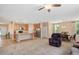 Open concept living area featuring a kitchen with a center island, dining area, and sitting area with a plush recliner at 6512 Blalock Forest Dr, Willow Springs, NC 27592